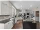Spacious kitchen with stainless steel appliances, custom cabinets, and granite countertops at 3826 Gaines Ct, Winter Haven, FL 33884