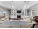 Inviting living room with a fireplace, built-in shelves, and comfortable seating at 3826 Gaines Ct, Winter Haven, FL 33884