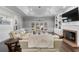 Spacious living room with fireplace, coffered ceiling, and backyard access at 3826 Gaines Ct, Winter Haven, FL 33884