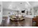 Open-concept living room with fireplace, built-ins, recessed lighting, and wood floors at 3826 Gaines Ct, Winter Haven, FL 33884
