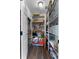 Organized walk-in pantry featuring shelving and storage for optimal organization at 3826 Gaines Ct, Winter Haven, FL 33884