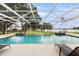 Relaxing poolside setting with lounge chairs and open views of the surrounding landscape at 3826 Gaines Ct, Winter Haven, FL 33884