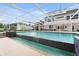 Large pool with waterfall feature set in a screened in enclosure with lawn at 3826 Gaines Ct, Winter Haven, FL 33884