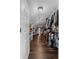 Spacious walk-in closet with custom shelving and hardwood floors provides ample storage at 3826 Gaines Ct, Winter Haven, FL 33884
