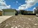 Landscaped one-story home with a two-car garage and freshly mowed lawn at 3851 Horizon View Loop, Lakeland, FL 33813