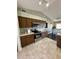 Modern kitchen featuring tile floors, dark cabinetry, and stainless steel appliances at 3851 Horizon View Loop, Lakeland, FL 33813