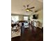 Inviting living room with a leather sectional, TV, and access to outdoor patio at 3851 Horizon View Loop, Lakeland, FL 33813