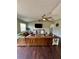 Cozy living room features a leather sectional, modern TV, and stylish decor at 3851 Horizon View Loop, Lakeland, FL 33813