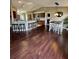 Open concept living space with kitchen island, breakfast nook, and dining room at 3851 Horizon View Loop, Lakeland, FL 33813