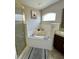 Bright main bathroom with a soaking tub and a separate glass enclosed shower at 3851 Horizon View Loop, Lakeland, FL 33813
