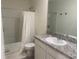 Bathroom featuring a shower/tub combo and granite countertop at 386 Feltrim Reserve Blvd # 386, Davenport, FL 33837