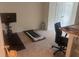 This bedroom includes an office space and treadmill for at-home exercise at 386 Feltrim Reserve Blvd # 386, Davenport, FL 33837