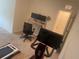Versatile bonus room with exercise equipment and desk, perfect for a home gym or office at 386 Feltrim Reserve Blvd # 386, Davenport, FL 33837