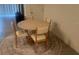 Dining area features a round table, four chairs, and a decorative rug at 386 Feltrim Reserve Blvd # 386, Davenport, FL 33837