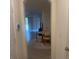 Warm entryway featuring a dining area visible through an archway, adorned with a patterned rug at 386 Feltrim Reserve Blvd # 386, Davenport, FL 33837