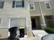 A well-kept townhome featuring an attached garage and front entry at 386 Feltrim Reserve Blvd # 386, Davenport, FL 33837