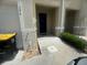 Townhome exterior showcases a paved walkway and driveway leading to an attached garage and front entrance at 386 Feltrim Reserve Blvd # 386, Davenport, FL 33837