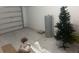 Unfinished garage with concrete flooring, water heater, and Christmas tree at 386 Feltrim Reserve Blvd # 386, Davenport, FL 33837
