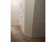 Hallway with neutral carpet, a door, and an electrical outlet at 386 Feltrim Reserve Blvd # 386, Davenport, FL 33837