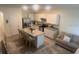 Contemporary kitchen boasts granite island, stainless appliances, and ample cabinet space at 386 Feltrim Reserve Blvd # 386, Davenport, FL 33837