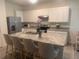 Bright kitchen with granite countertops and stainless steel appliances at 386 Feltrim Reserve Blvd # 386, Davenport, FL 33837