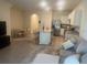 Cozy living room featuring an island, open kitchen, and dining area at 386 Feltrim Reserve Blvd # 386, Davenport, FL 33837