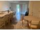 Open-concept living room with kitchen island, dining area, and comfortable seating at 386 Feltrim Reserve Blvd # 386, Davenport, FL 33837