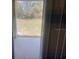 View of the backyard from the covered patio, accessible through sliding glass doors at 386 Feltrim Reserve Blvd # 386, Davenport, FL 33837