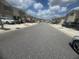 Charming street view showcasing townhomes, each with its own garage and well-maintained landscaping at 386 Feltrim Reserve Blvd # 386, Davenport, FL 33837