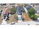 Aerial view of house showcasing a driveway, landscaping, and the roof at 404 Rio Grande Ct, Poinciana, FL 34759