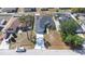 An aerial view of the house showcasing landscaping, driveway, and roof at 404 Rio Grande Ct, Poinciana, FL 34759