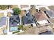 Aerial view of a home with solar panels and lush greenery, highlighting sustainable living and attractive landscaping at 404 Rio Grande Ct, Poinciana, FL 34759