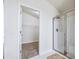 Bathroom showcases walk-in closet, glass-enclosed shower, and neutral decor at 404 Rio Grande Ct, Poinciana, FL 34759
