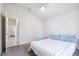 Bedroom featuring plush carpeting, door to hall, and ample sunlight at 404 Rio Grande Ct, Poinciana, FL 34759