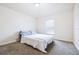 Cozy bedroom featuring neutral carpeting, window, and comfortable furnishings at 404 Rio Grande Ct, Poinciana, FL 34759