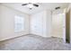 Bedroom features plush carpeting, window, and a closet with double doors at 404 Rio Grande Ct, Poinciana, FL 34759