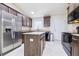 Beautiful kitchen with stainless steel appliances, granite countertops, and a functional center island at 404 Rio Grande Ct, Poinciana, FL 34759