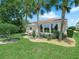 Beautifully landscaped backyard with mature palm trees at 4148 Dunmore Dr, Lake Wales, FL 33859