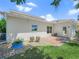 Backyard view of patio and well-maintained lawn at 4148 Dunmore Dr, Lake Wales, FL 33859
