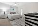 Well-lit bedroom showcases a stylish rug, comfortable bed, and contemporary decor at 4148 Dunmore Dr, Lake Wales, FL 33859