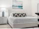 Bright bedroom features a comfortable bed, modern decor, and a tranquil atmosphere at 4148 Dunmore Dr, Lake Wales, FL 33859