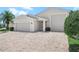 Charming home featuring a three-car garage and brick paved driveway at 4148 Dunmore Dr, Lake Wales, FL 33859