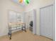 Functional laundry room with bi-fold door, a utility sink, and a front-loading washer and dryer at 4148 Dunmore Dr, Lake Wales, FL 33859