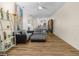 Spacious living room with hardwood floors, gray sectional, ceiling fan, and bright natural light at 4148 Dunmore Dr, Lake Wales, FL 33859