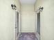 Covered patio with dual entry doors and lantern lighting at 4148 Dunmore Dr, Lake Wales, FL 33859