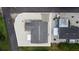 Aerial view shows a home with low maintenance landscaping, dark roof, white trim, and a shed at 4228 Nandina St, Lake Wales, FL 33898