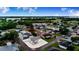 Aerial view showcases a home nestled in a serene community near a lake and lush greenery at 4228 Nandina St, Lake Wales, FL 33898
