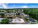 Aerial neighborhood view with houses surrounded by trees, with the lake in the background at 4228 Nandina St, Lake Wales, FL 33898