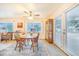 Cozy dining room with ceiling fan, wood table with seating for four, bright windows and natural light at 4228 Nandina St, Lake Wales, FL 33898