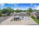 Charming home showcasing white gravel landscaping, a screened porch, and a separate storage shed at 4228 Nandina St, Lake Wales, FL 33898